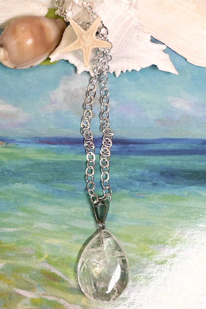 rock crystal droplet pendant is cut from natural stone.