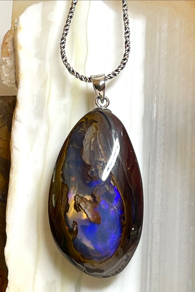 This is a really special piece of Australian Boulder Opal, it has a clear crystal window allowing you to see right into, and through the  piece.