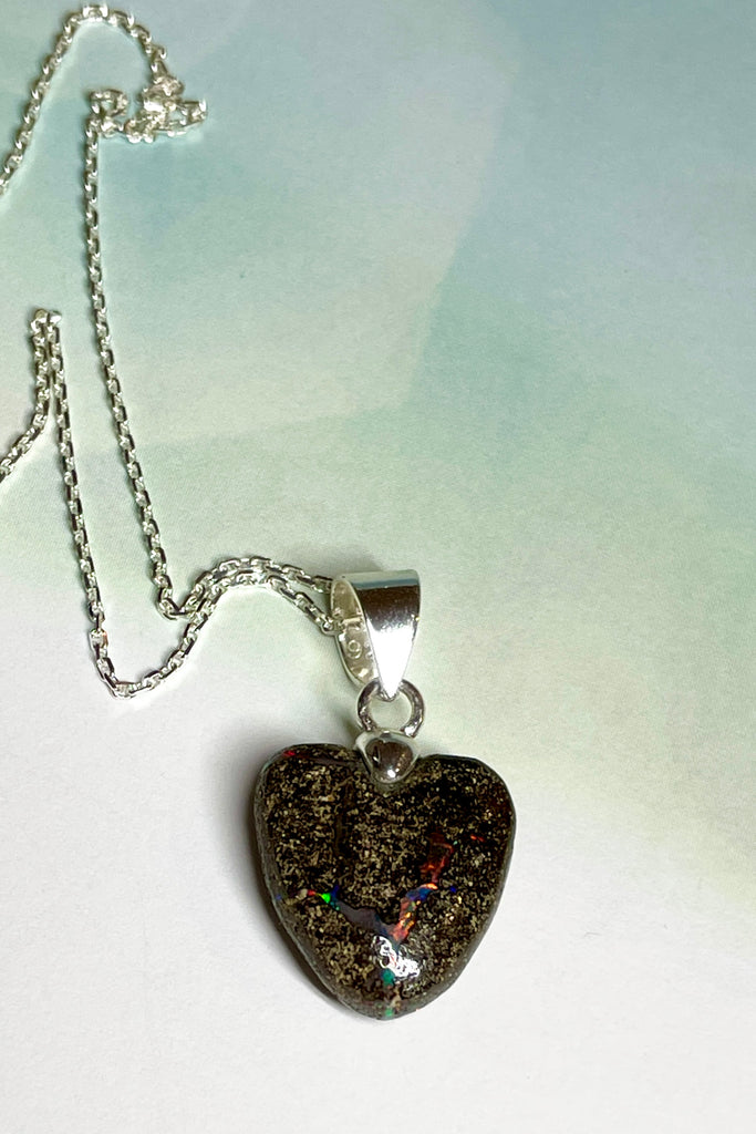 From our range of Australian opal heart pendants.  This intriguing piece of Boulder Opal was mined at Winton, then cut and polished for Mombasa Rose in Noosa, Queensland