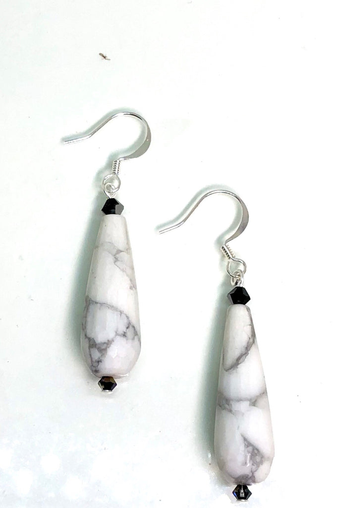 Earrings Rock Droplet White Marbled features approximately 6cm length, drop style earrings. 925 silver hook earrings and black teardrop shaped stone with a swarovski crystal bead on top.