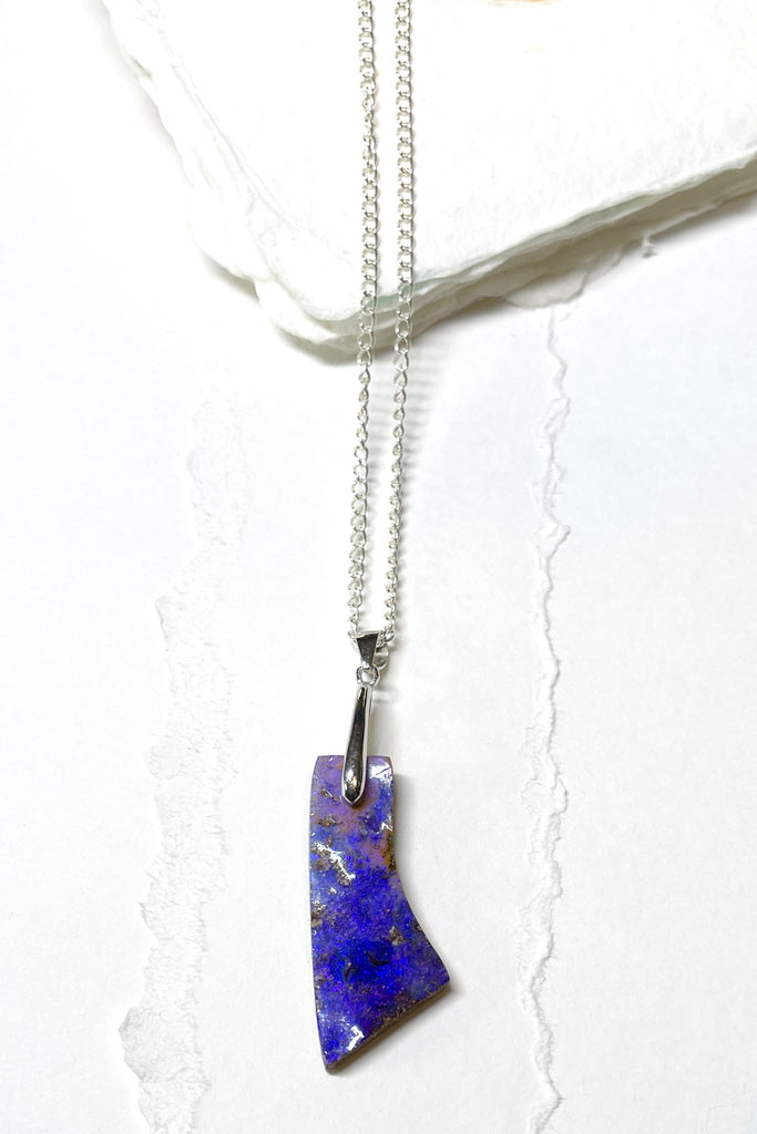 This is a one off piece, a hand cut opal, it shows the mark of the artist who cut and polished the stone. This genuine Australian Opal pendant stone was cut and polished in Australia. 