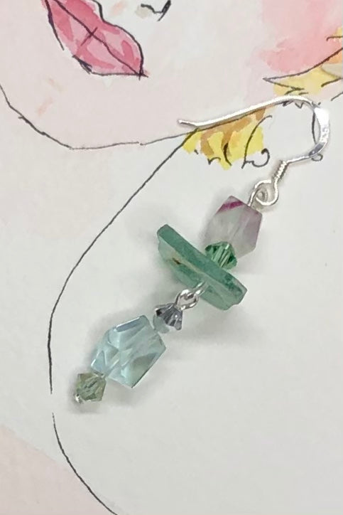 Hand cut antique glass set off with pale aqua Fluorite and swarovski crystal beads.