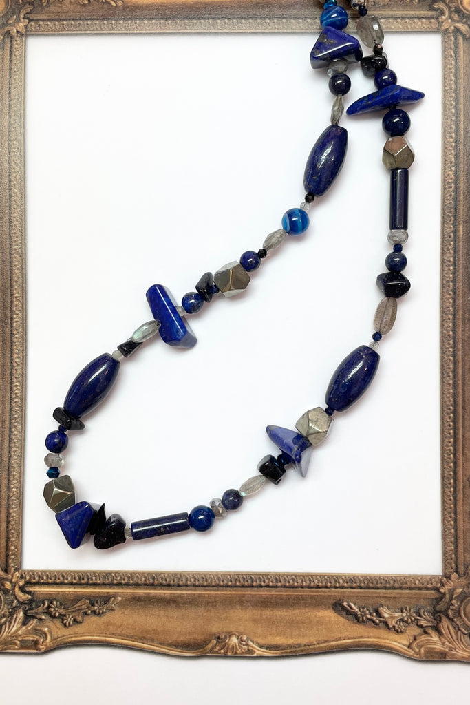 a sweet choker style hand made using an assortment of blue gemstones. These include Lapis Lazuli, Agate, Labradorite and natural Pyrite. 