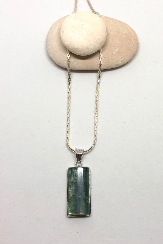 The Pendant of Kyanite on a Silver Chain 3 is a purity of a lovey natural crystal pendant polished to a high shine, 3cm length and 1cm width.