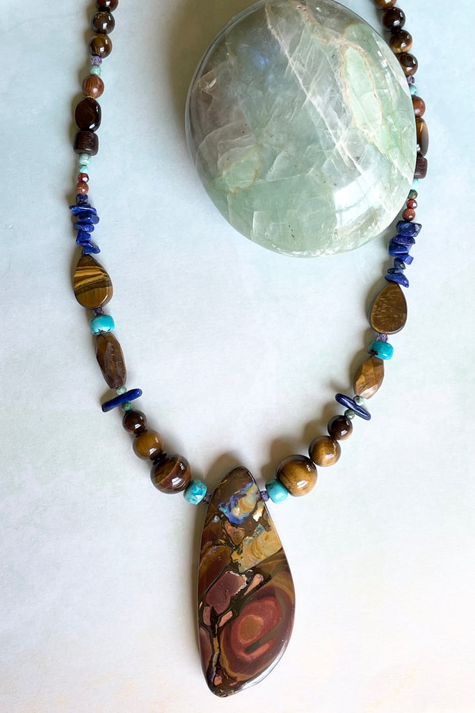 This necklace has been designed using natural Opal and many different semi precious gemstones