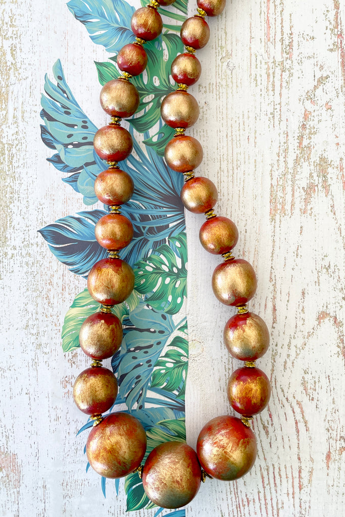  A Long necklace with hand painted beads in graduating sizes