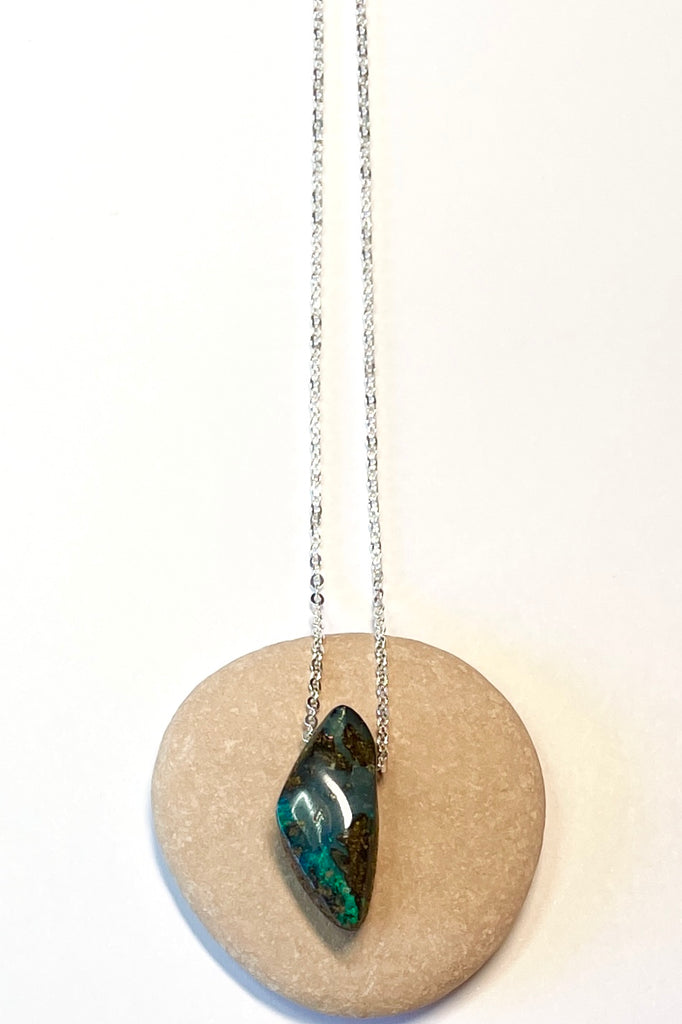 This tiny pendant is made by fusing a fine flash slice of Australian crystal opal into natural boulder stone.