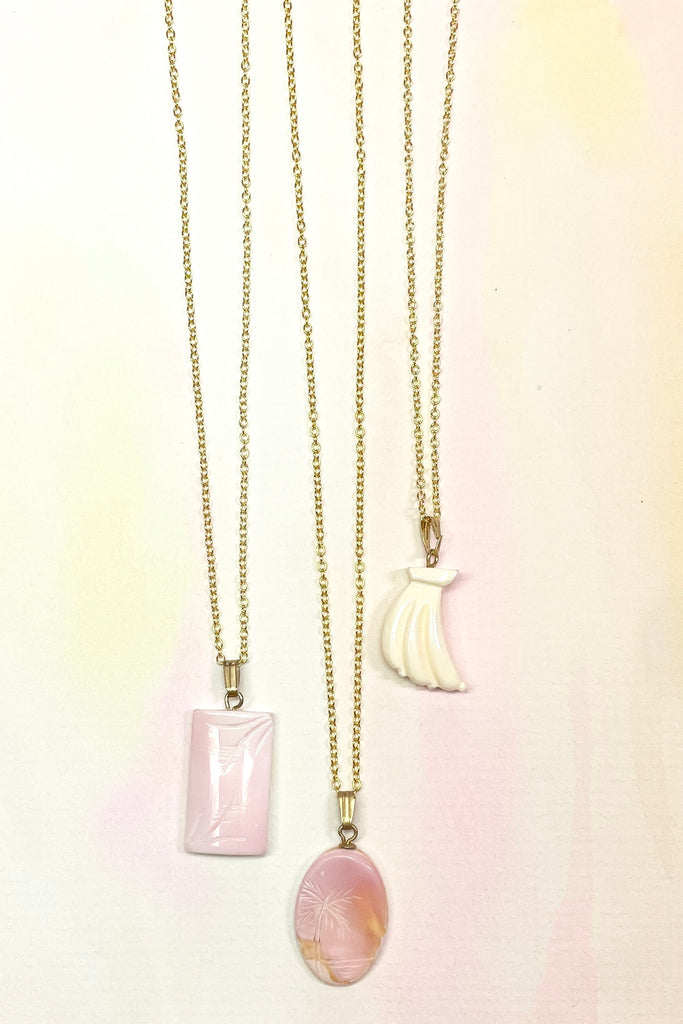 Rare pink conch shell hand carved into an island style. Comes on a gold vermeil chain