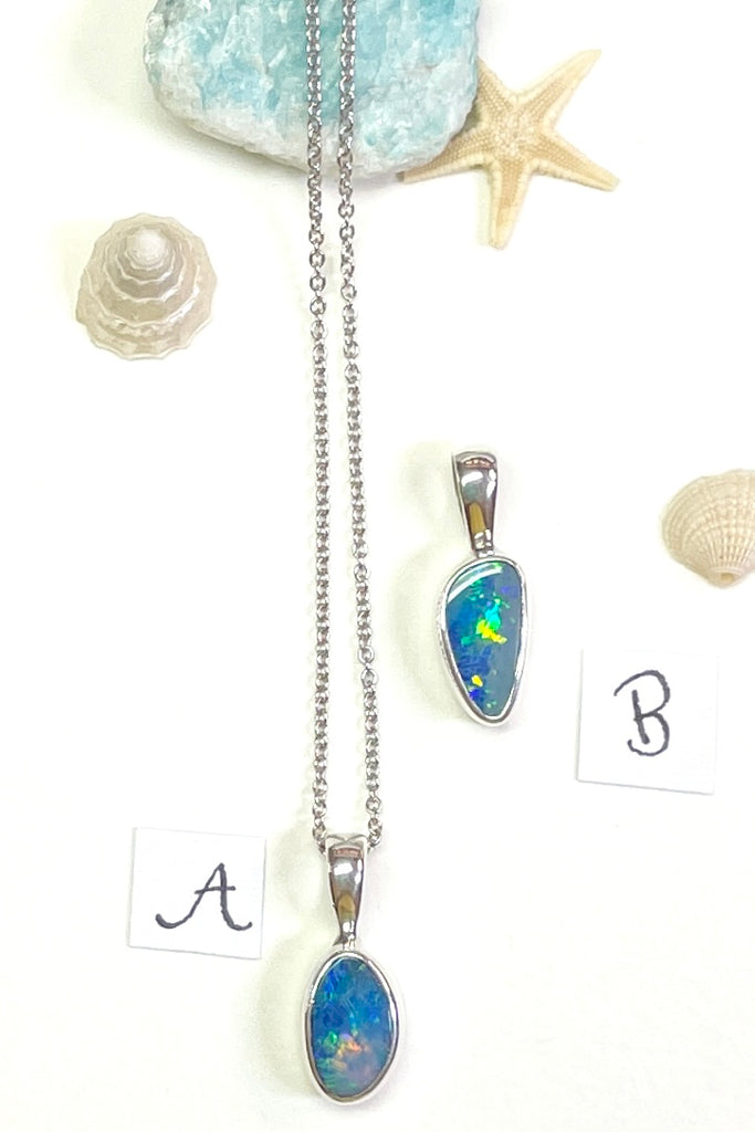 The Australian opal pendant is shaped into a small round oval shape, very dainty.