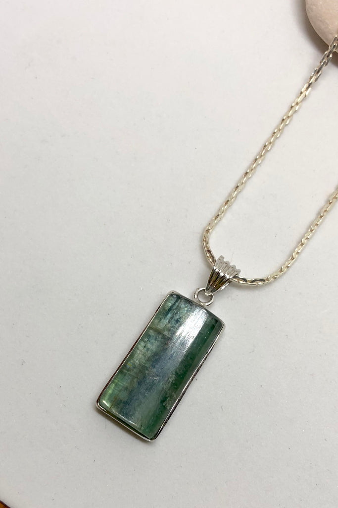 The Pendant of Kyanite on a Silver Chain 3 is a purity of a lovey natural crystal pendant polished to a high shine, 3cm length and 1cm width.