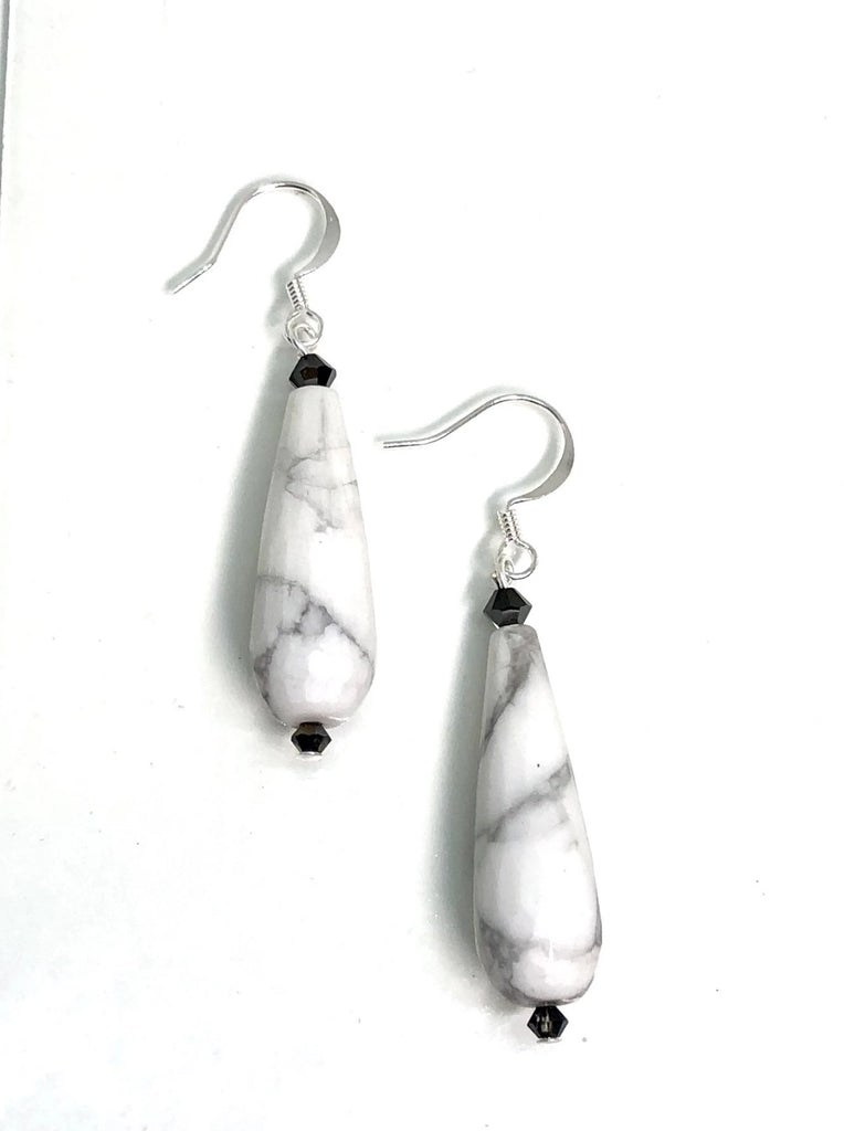 Earrings Rock Droplet White Marbled features approximately 6cm length, drop style earrings. 925 silver hook earrings and black teardrop shaped stone with a swarovski crystal bead on top.