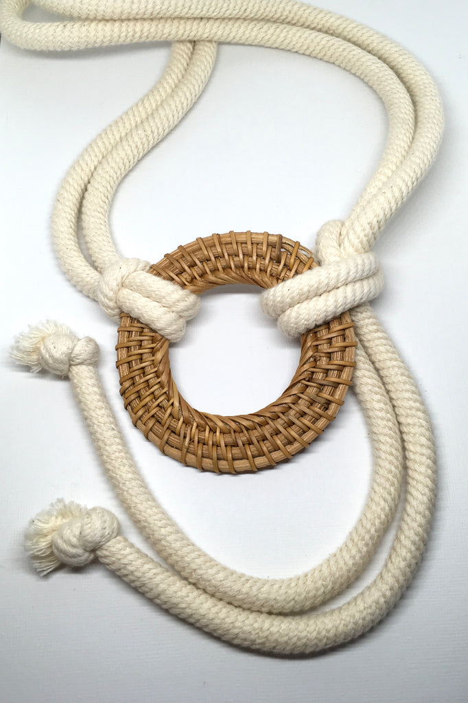 A thick cream rope with a natural tan rattan belt loop