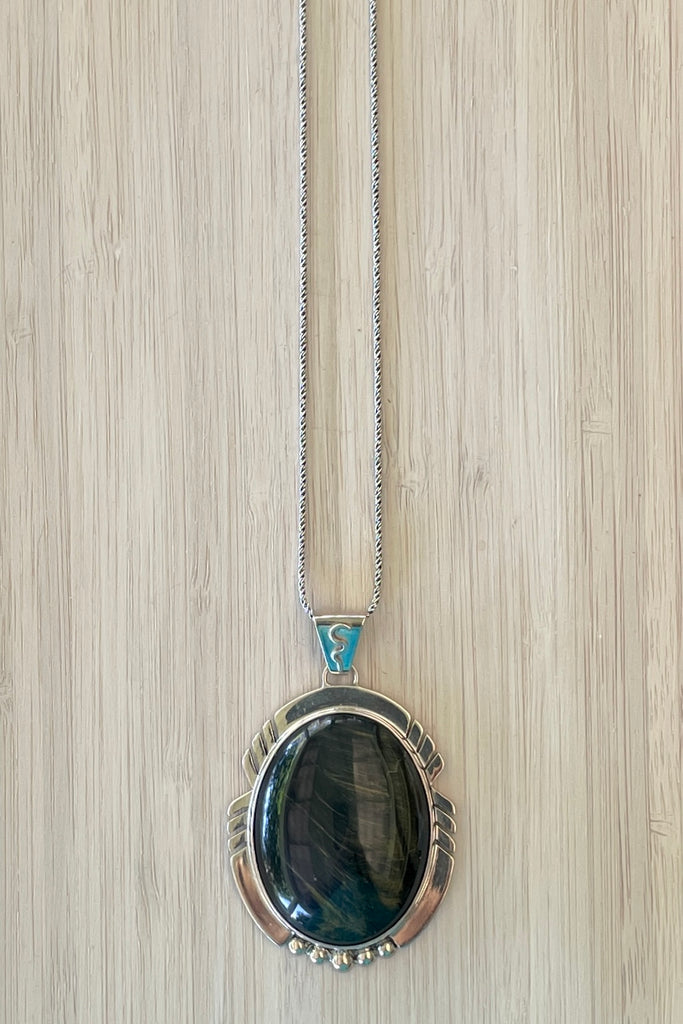 A modernist pendant in a unique design, the blue Labradorite stone was cut and faceted by a local