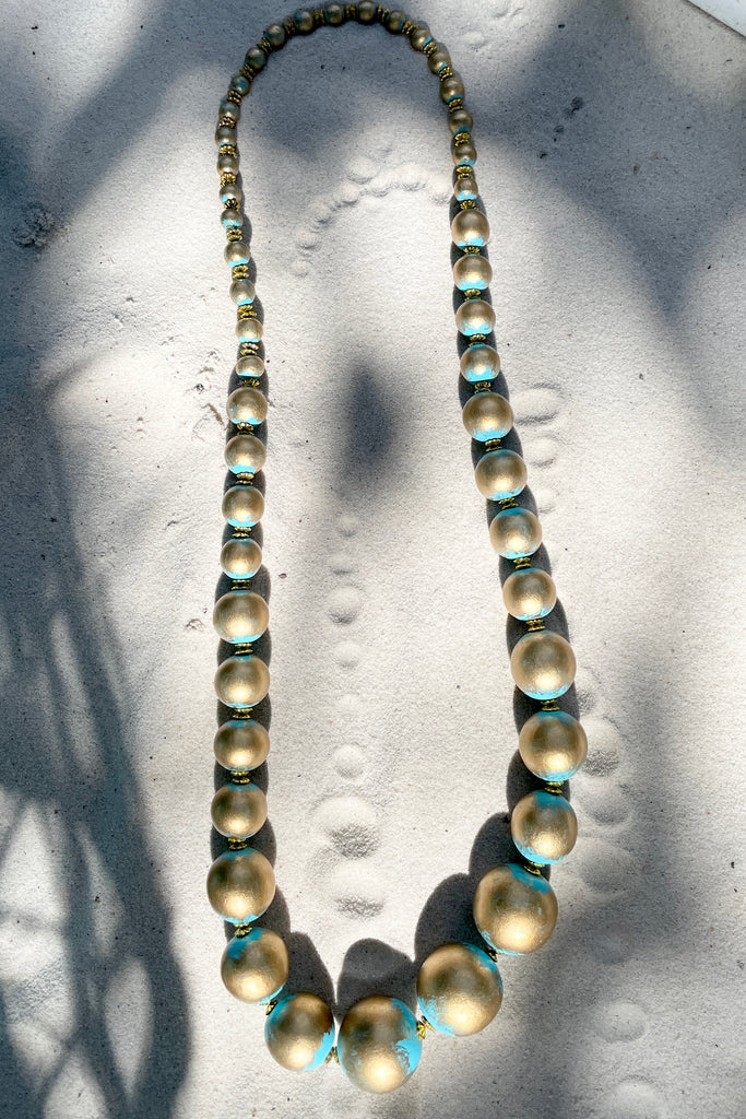  A Long necklace with hand painted beads in graduating sizes