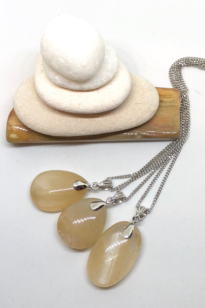 The Pendant of Golden Rutilated Quartz on a Silver Chain 1  will bring through intense energy featuring 3.5 cm length and coming on a silver chain.