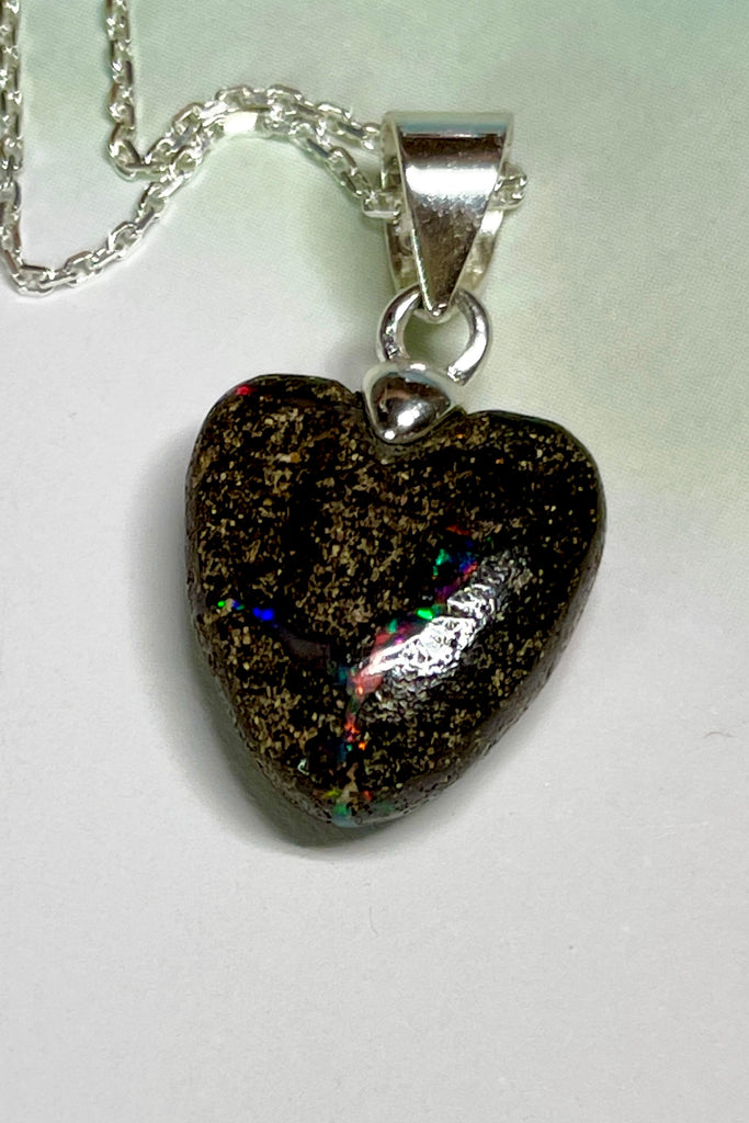 From our range of Australian opal heart pendants.  This intriguing piece of Boulder Opal was mined at Winton, then cut and polished for Mombasa Rose in Noosa, Queensland