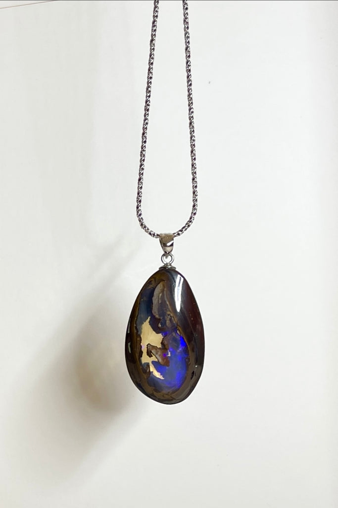 This is a really special piece of Australian Boulder Opal, it has a clear crystal window allowing you to see right into, and through the  piece.