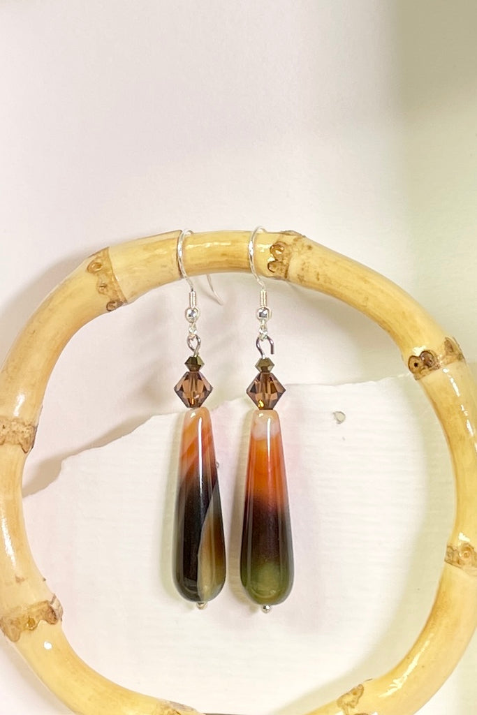 Teardrop style earrings are in coloured agate stone