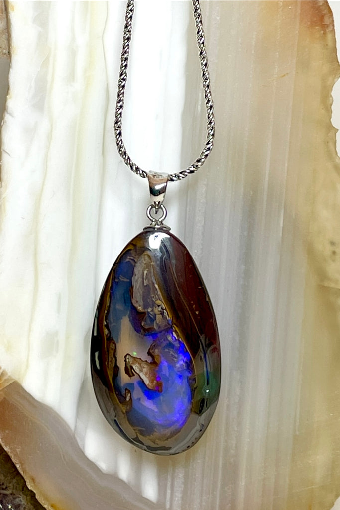 This is a really special piece of Australian Boulder Opal, it has a clear crystal window allowing you to see right into, and through the  piece.