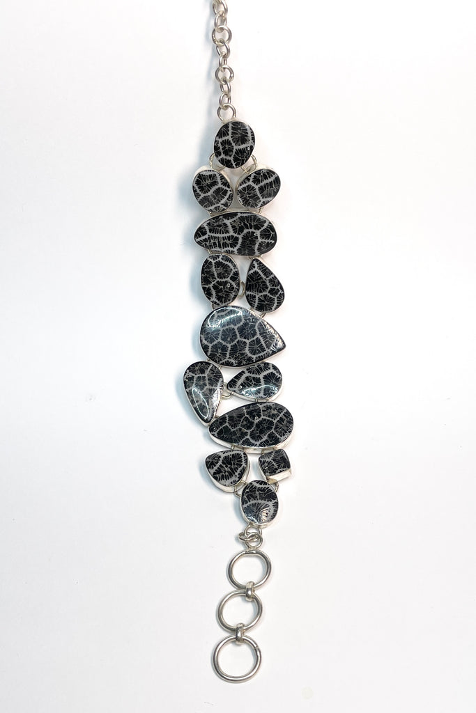 lovely Smokey silver grey mother of pearl bracelet, each shape has been individually set and rim set into heavy 925 silver. A very pretty and well made bracelet.