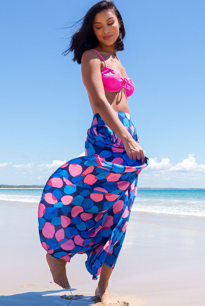The Atlantis Maxi Skirt Features A Double V-Shaped Waist Yoke, Inset Panels On The Front From The Yoke Down, Very Full Skirt, Elasticated Back Of Waist And Side Pockets. This Is A slip On Design With A Shapely Hemline And Slightly Longer Front Due To The Inset Panels. The Bubbles Zinzi Print Is A Navy Base With Large Blue And Pink Spots. Made From 100% Viscose