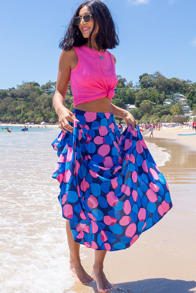 The Atlantis Maxi Skirt Features A Double V-Shaped Waist Yoke, Inset Panels On The Front From The Yoke Down, Very Full Skirt, Elasticated Back Of Waist And Side Pockets. This Is A slip On Design With A Shapely Hemline And Slightly Longer Front Due To The Inset Panels. The Bubbles Zinzi Print Is A Navy Base With Large Blue And Pink Spots. Made From 100% Viscose