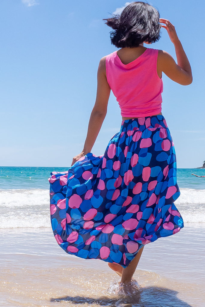 The Atlantis Maxi Skirt Features A Double V-Shaped Waist Yoke, Inset Panels On The Front From The Yoke Down, Very Full Skirt, Elasticated Back Of Waist And Side Pockets. This Is A slip On Design With A Shapely Hemline And Slightly Longer Front Due To The Inset Panels. The Bubbles Zinzi Print Is A Navy Base With Large Blue And Pink Spots. Made From 100% Viscose