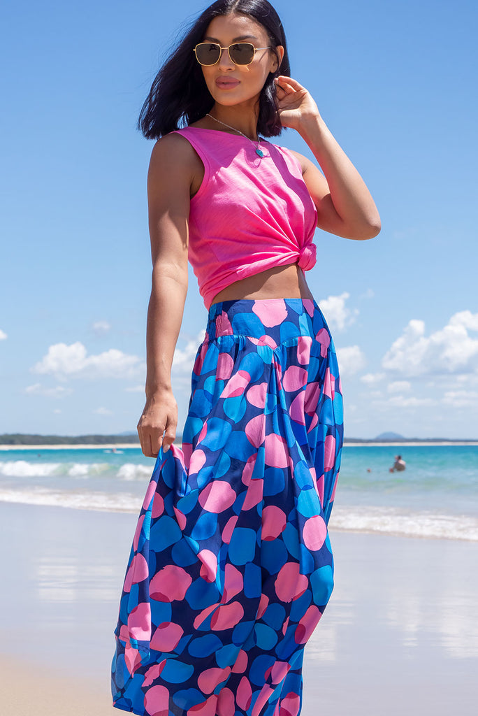 The Atlantis Maxi Skirt Features A Double V-Shaped Waist Yoke, Inset Panels On The Front From The Yoke Down, Very Full Skirt, Elasticated Back Of Waist And Side Pockets. This Is A slip On Design With A Shapely Hemline And Slightly Longer Front Due To The Inset Panels. The Bubbles Zinzi Print Is A Navy Base With Large Blue And Pink Spots. Made From 100% Viscose