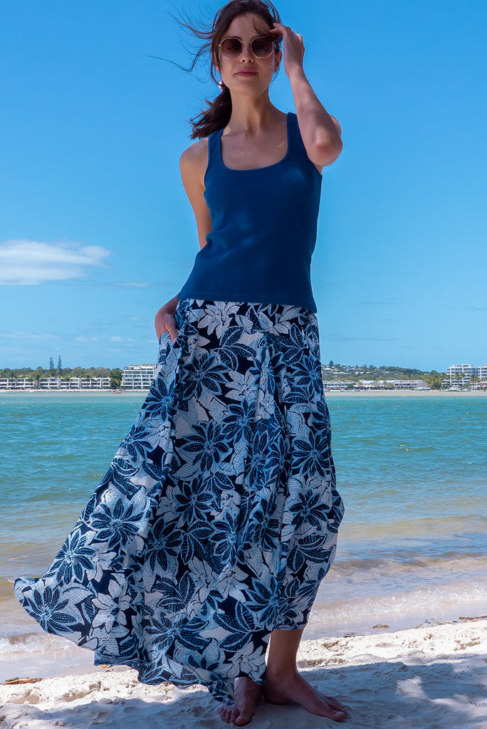 The Atlantis Pattaya Blue Maxi Skirt is a stunning navy maxi skirt with a contrasted floral print in white and blues. The skirt features a double v-shaped waist yoke, inset panels on the front from the yoke down, very full skirt, elasticated back of waist and side pockets. This is a slip on design with a shapely hemline and slightly longer front due to the inset panels. Made From 100% Viscose.