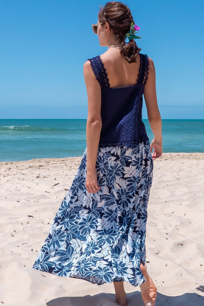 The Atlantis Pattaya Blue Maxi Skirt is a stunning navy maxi skirt with a contrasted floral print in white and blues. The skirt features a double v-shaped waist yoke, inset panels on the front from the yoke down, very full skirt, elasticated back of waist and side pockets. This is a slip on design with a shapely hemline and slightly longer front due to the inset panels. Made From 100% Viscose.