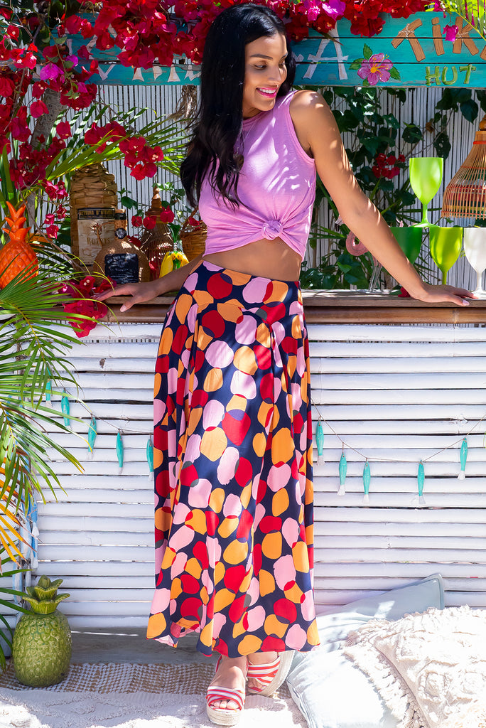 The Atlantis Zinzi Spot Maxi Skirt features double V-shaped waist yoke, side pockets and 100% viscose in  ink base with pink, orange and red spots.