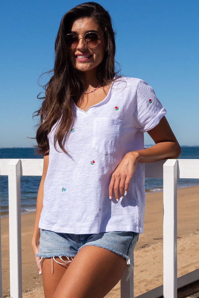 A simple and sweet flower print embroidered on a crisp, white cotton base makes the new Aurora T-shirt in Light a fresh alternative to the classic white tee. Easy fit white cotton T-shirt.