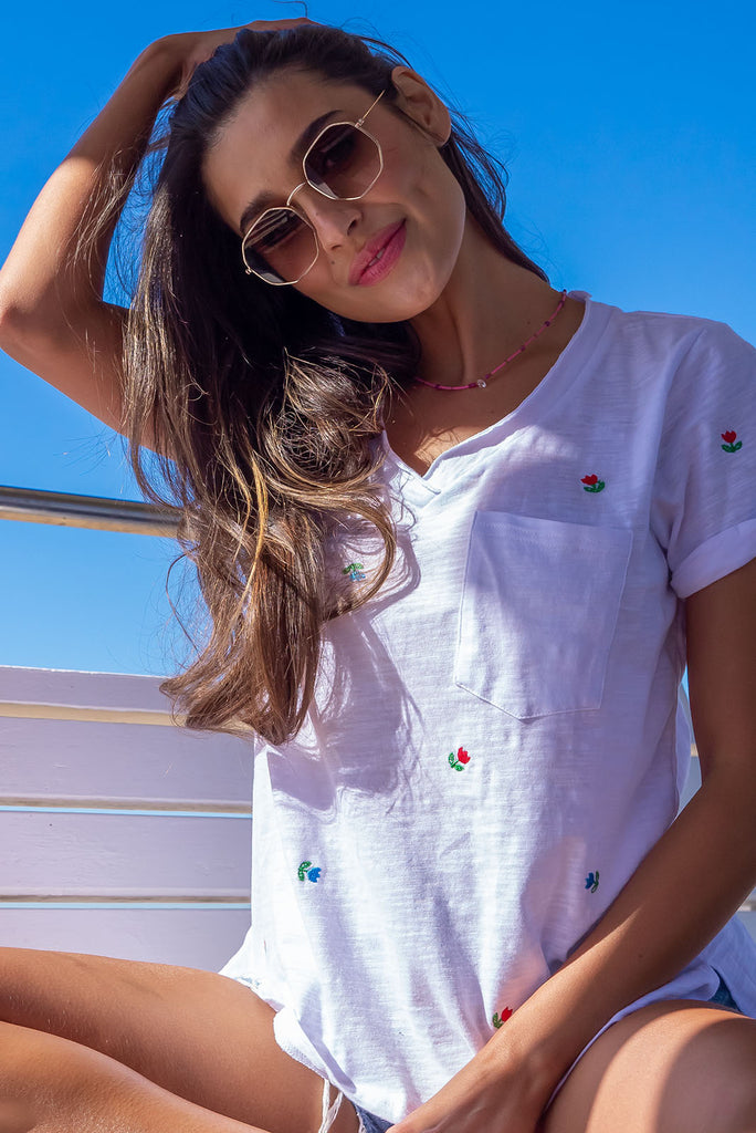 A simple and sweet flower print embroidered on a crisp, white cotton base makes the new Aurora T-shirt in Light a fresh alternative to the classic white tee. Easy fit white cotton T-shirt.