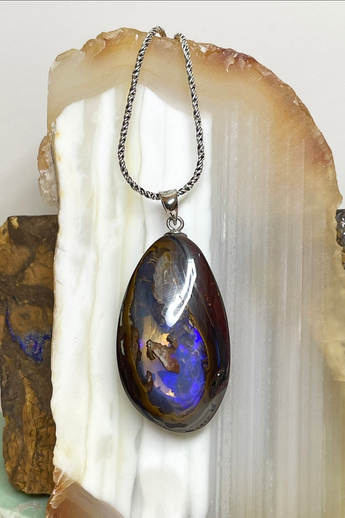 This is a really special piece of Australian Boulder Opal, it has a clear crystal window allowing you to see right into, and through the  piece.