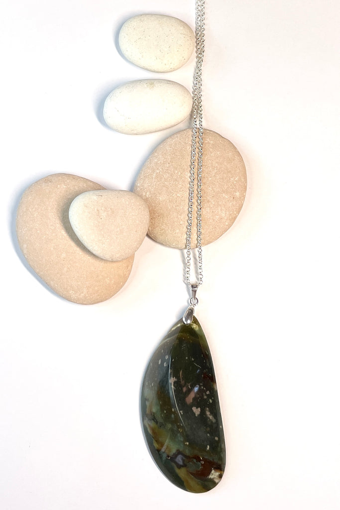 This pendant is a lovely piece of deep grey green Agate stone that has been skillfully cut into a pleasing swirl shape then polished, by ROAM Ladies Lapidary Collective in Sakaraha, Madagascar.