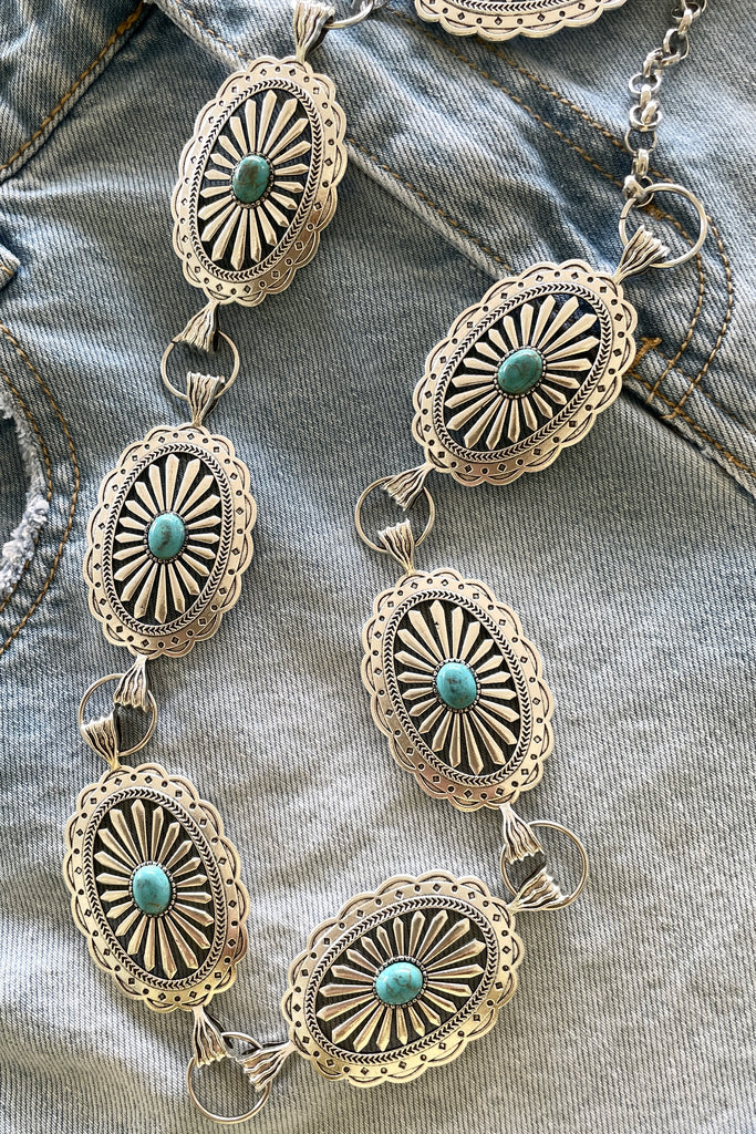 Santa Fe style Conch belt with Turquoise is sure to be one for the bohemian cowgirl