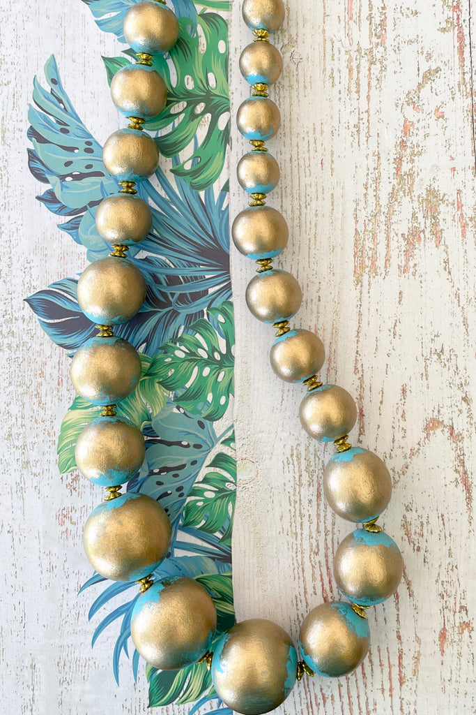  A Long necklace with hand painted beads in graduating sizes