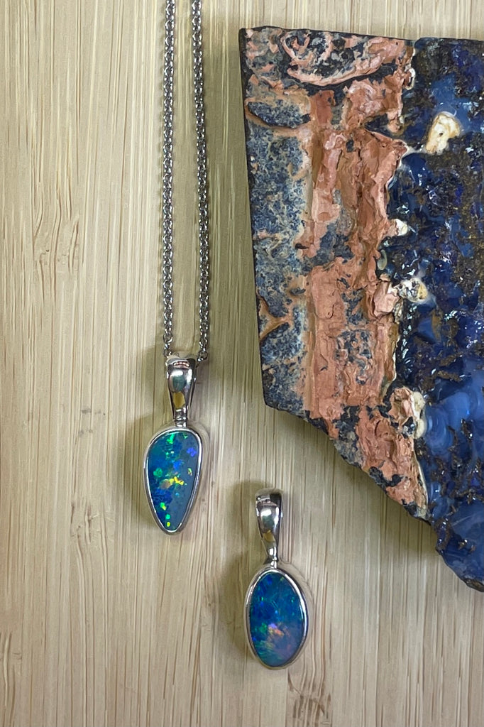 The Australian opal pendant is shaped into a small round oval shape, very dainty.