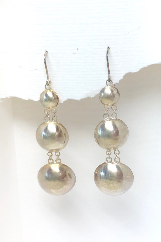 silver earrings in dome shape
