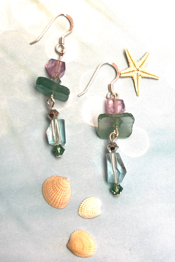 Hand cut antique glass set off with pale aqua Fluorite and swarovski crystal beads.