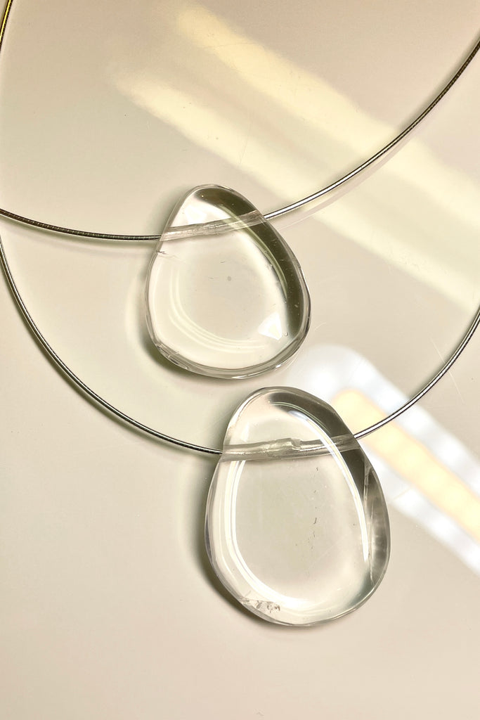 The Pendant is a gorgeous clear rock crystal, it hangs from a 925 silver Omega chain.
