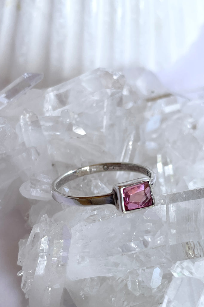 This natural pink tourmaline has been cut in an elegant free form geometric style, then set to fit its unique lines and brilliant colours creating a one of a kind piece. 