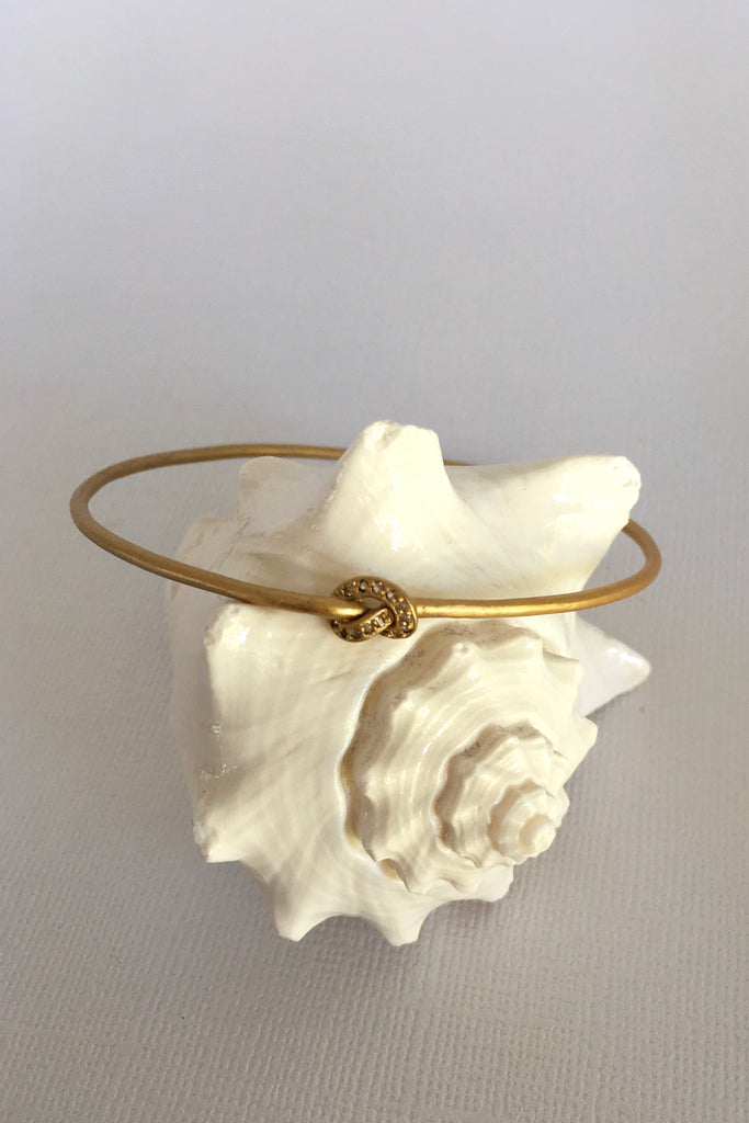 This adorable bangle has Luna appeal it is handcrafted in gold plated  silver vermeil. The gems are studded randomly and will sparkle at different angles
