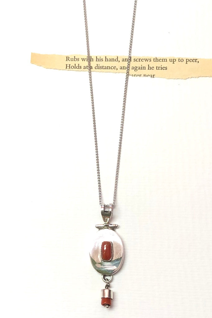 Echo Red Coral and Silver Vintage Pendant is an old piece that has a polished deep red orange coloured coral and 925 silver set pendant featuring oval design.