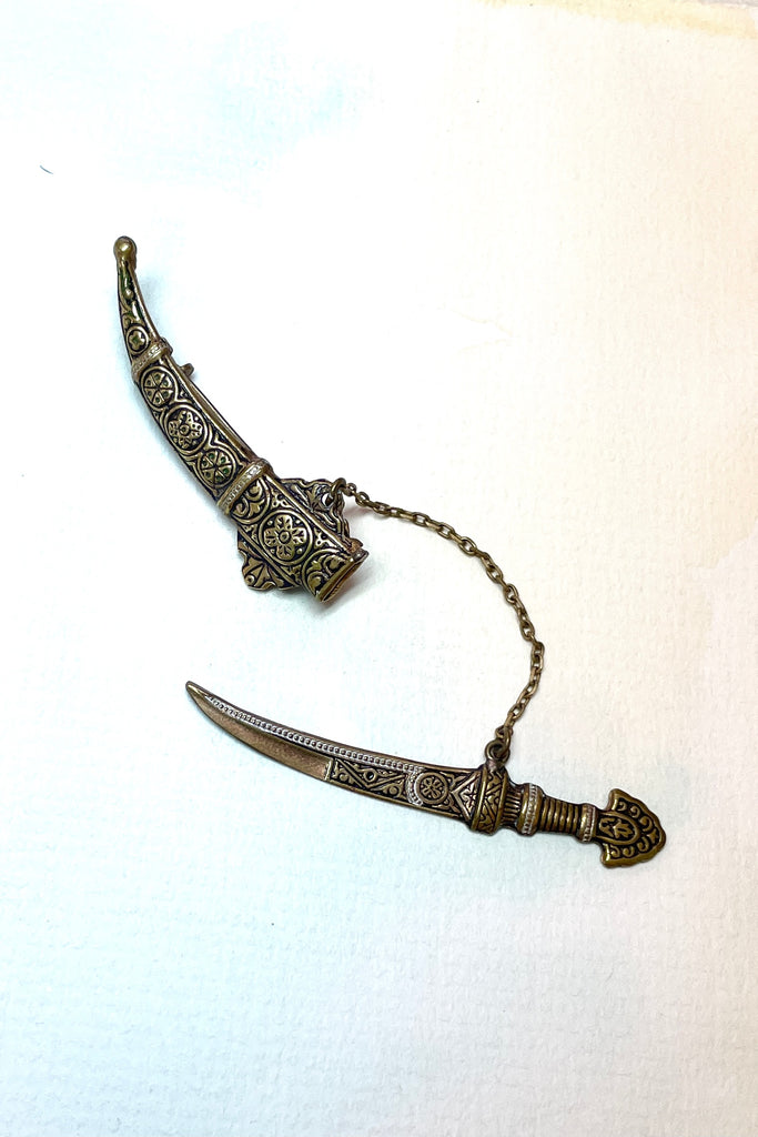 Vintage Damascene dagger and sheath brooch.