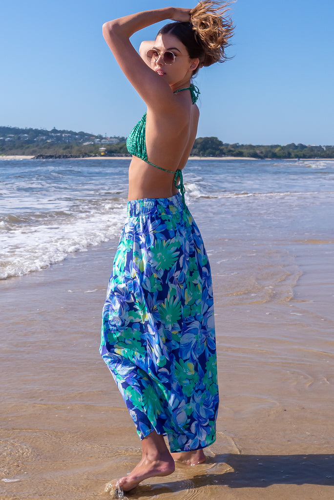 The Bikini Top Green Swirl is a 100% woven rayon triangle cut bikini with a green paisley design. The bikini top features an adjustable tie neck and back.