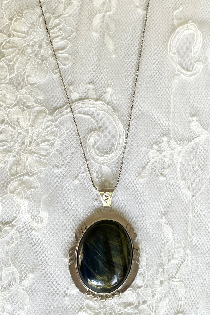 A modernist pendant in a unique design, the blue Labradorite stone was cut and faceted by a local