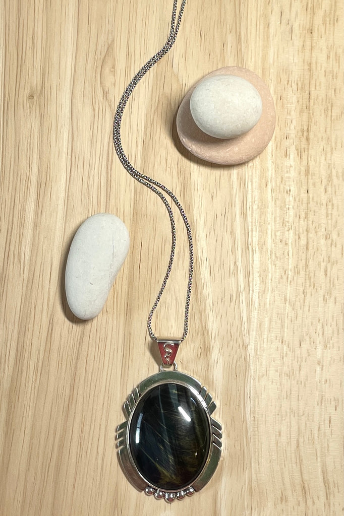 A modernist pendant in a unique design, the blue Labradorite stone was cut and faceted by a local 