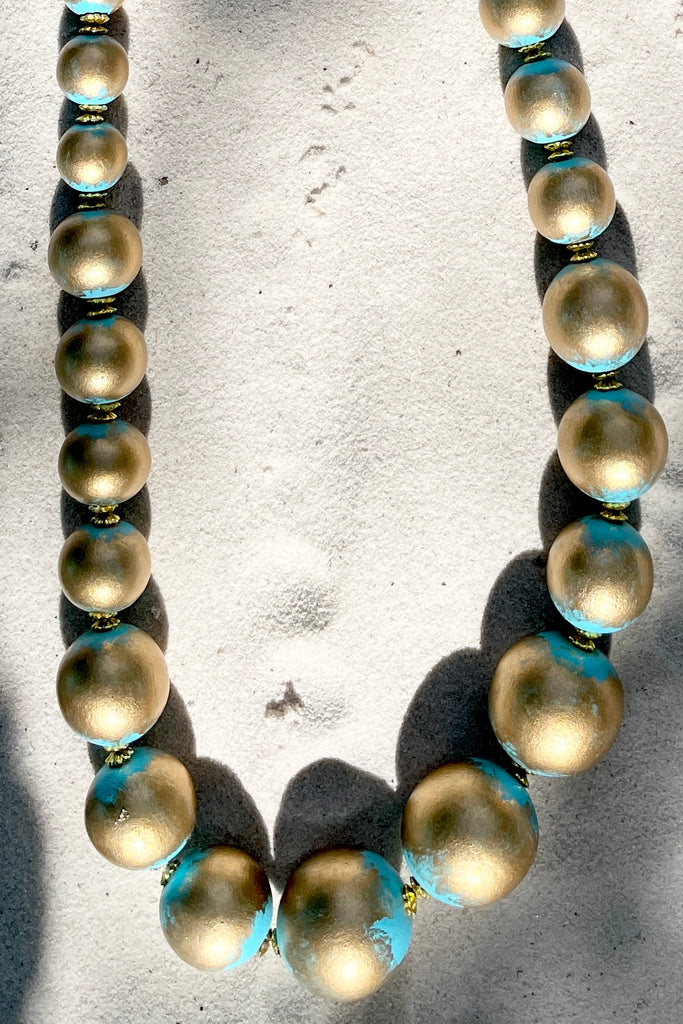  A Long necklace with hand painted beads in graduating sizes