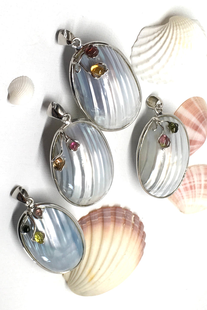 A sweet gentle shell pendant, in pale silvery blue